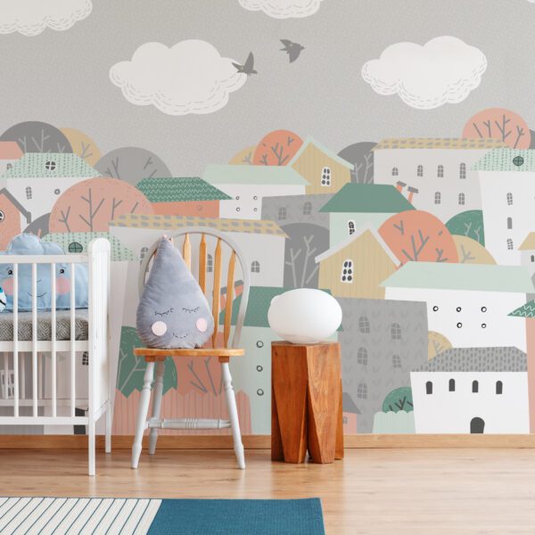 Cute grey raindrop shaped cushion placed on wooden chair standing next to white crib in bright baby room interior